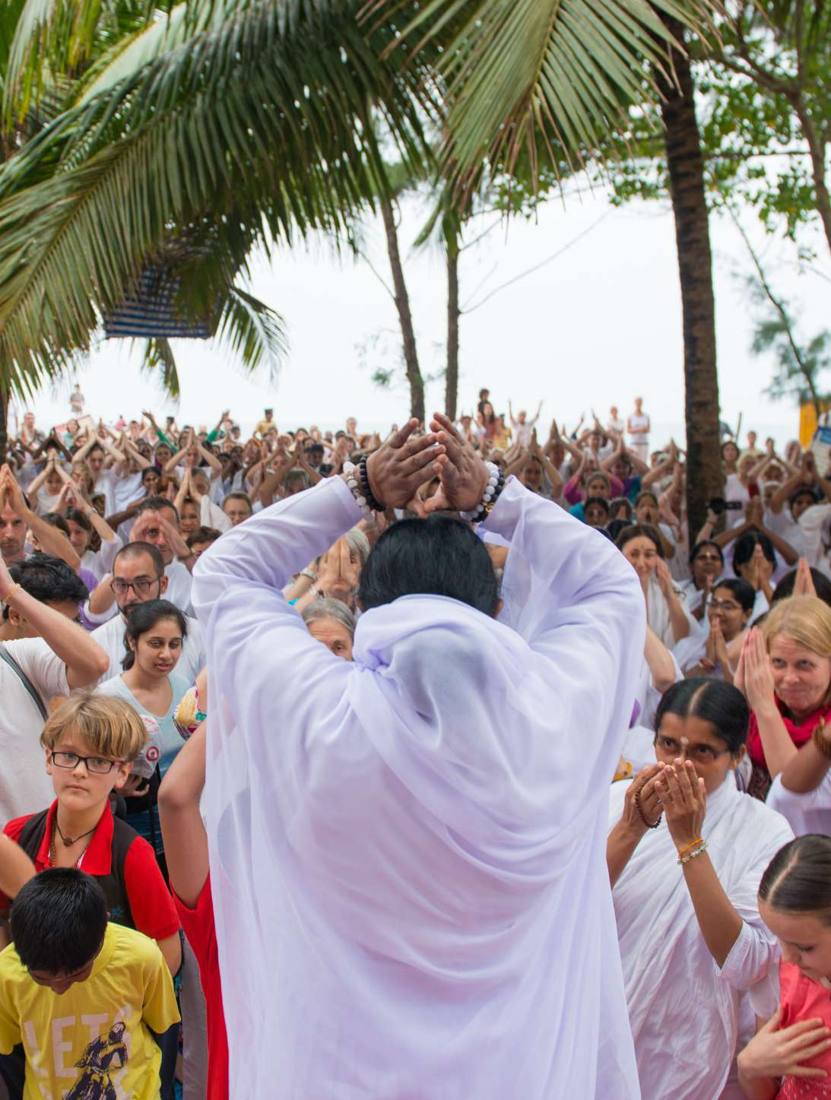 Amma at a public programme surrounded by devotees