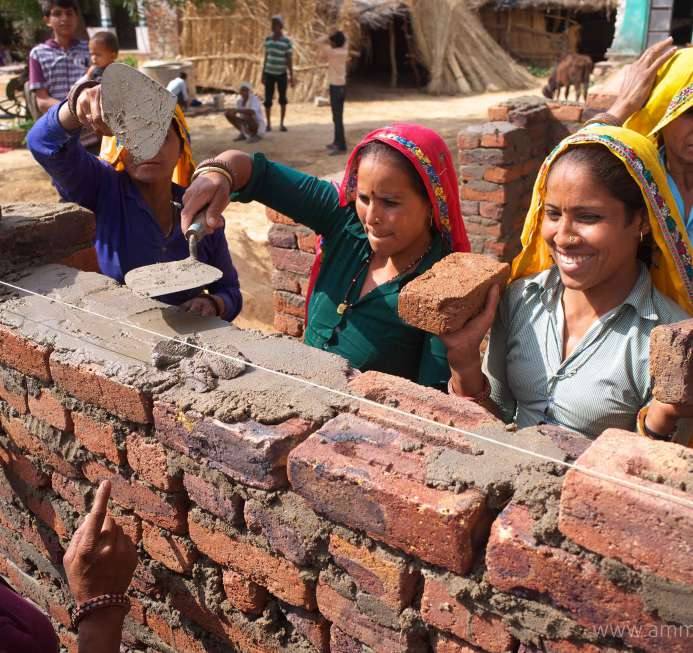 Women laying bricks